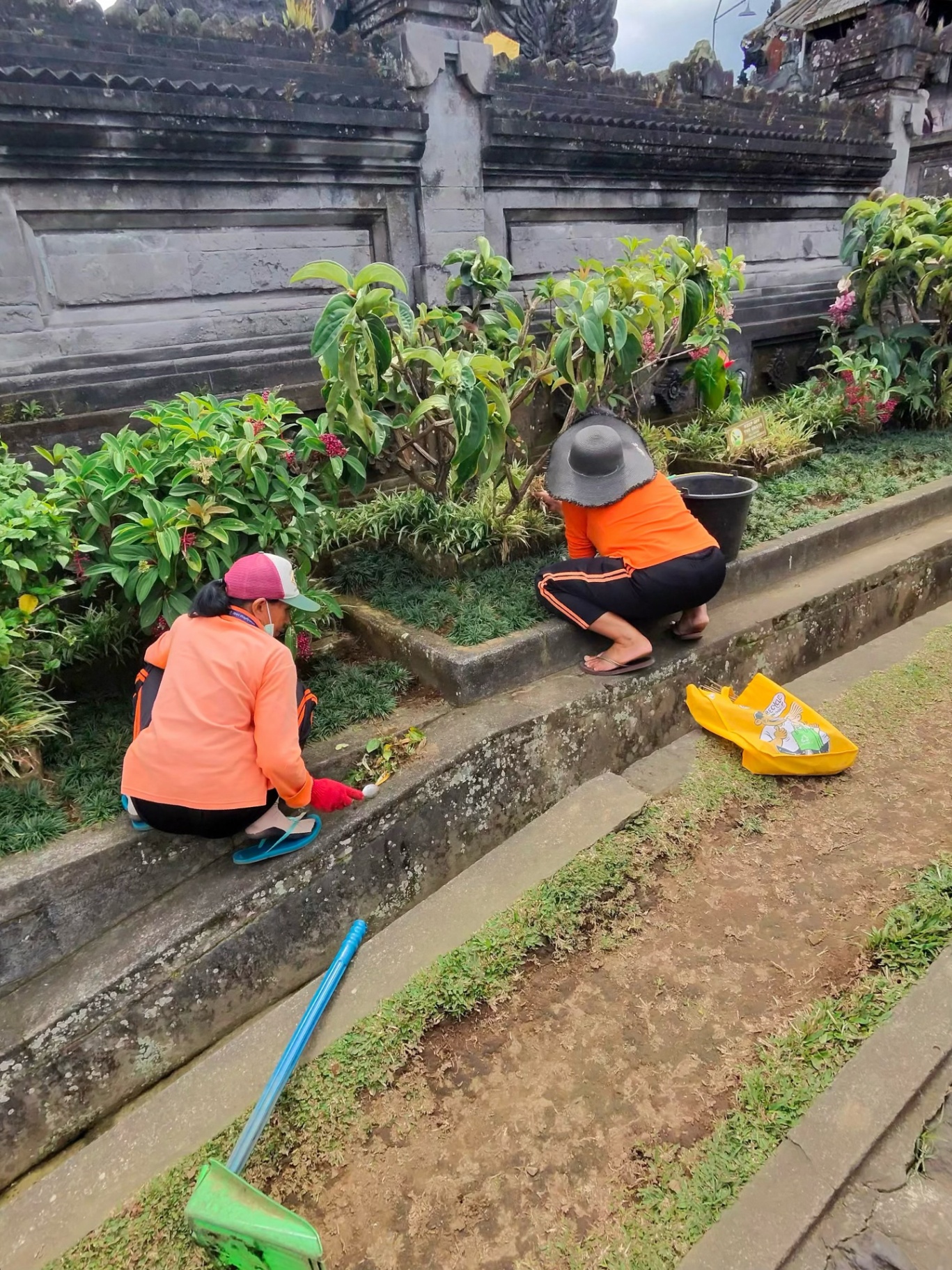 Balinese women tending the temple gardens with quiet devotion