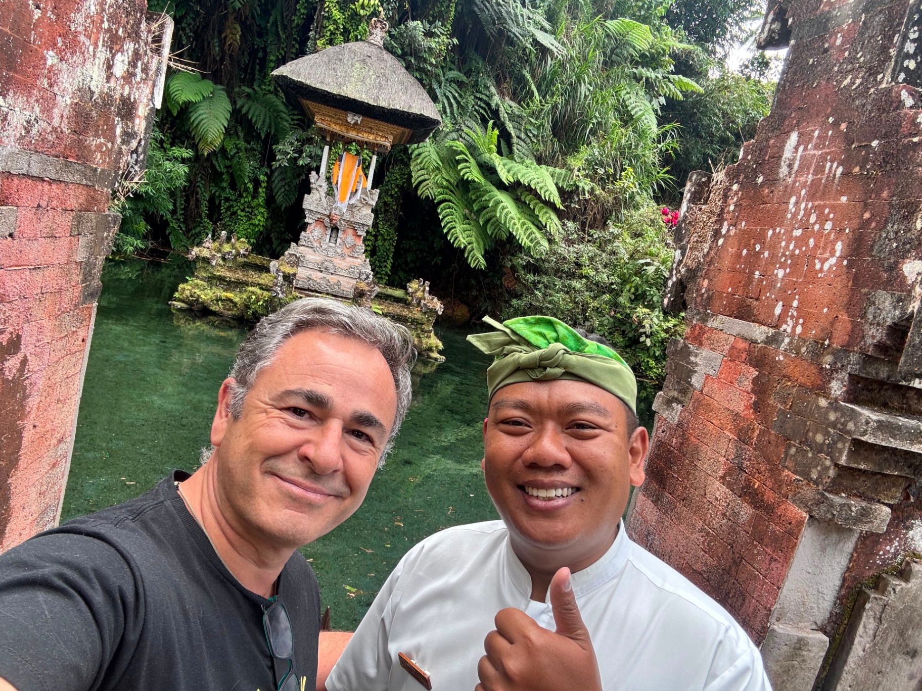 Luis with a Balinese temple guardian at the holy spring
